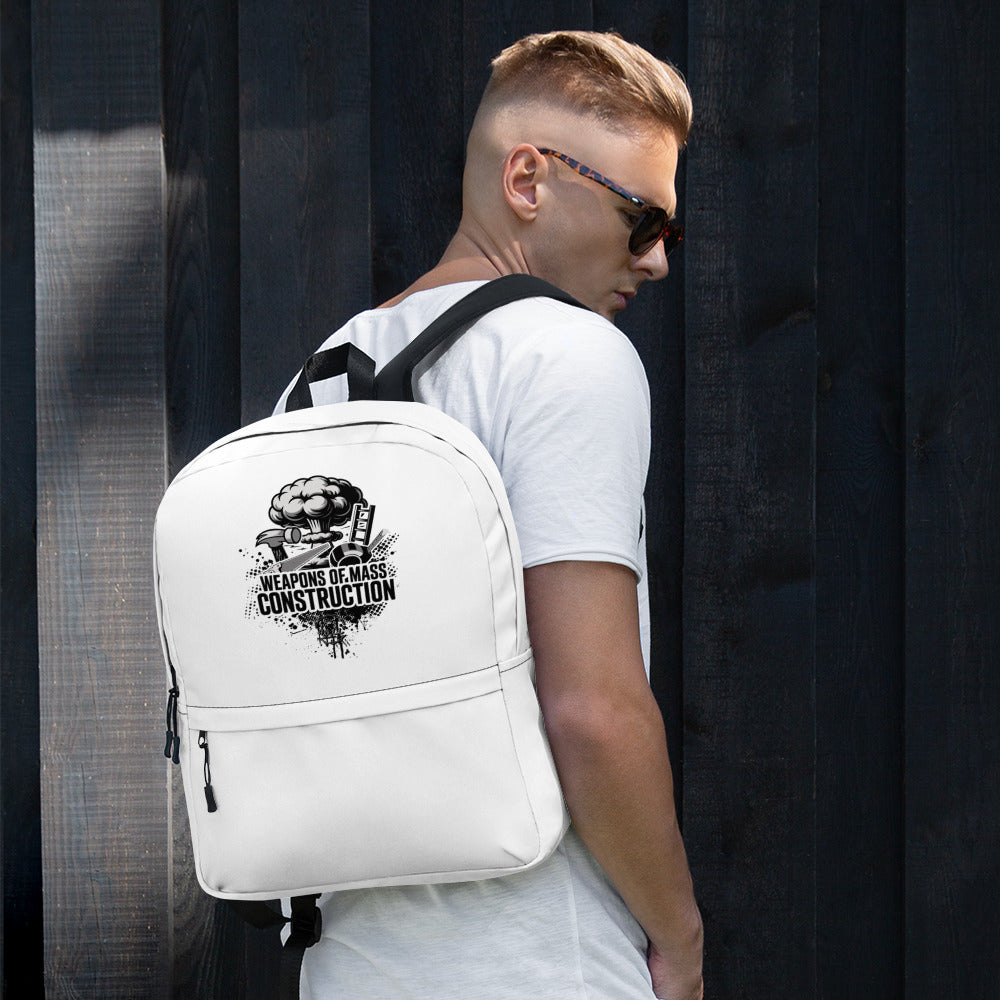 Person wearing a white backpack with a graphic design on a dark background